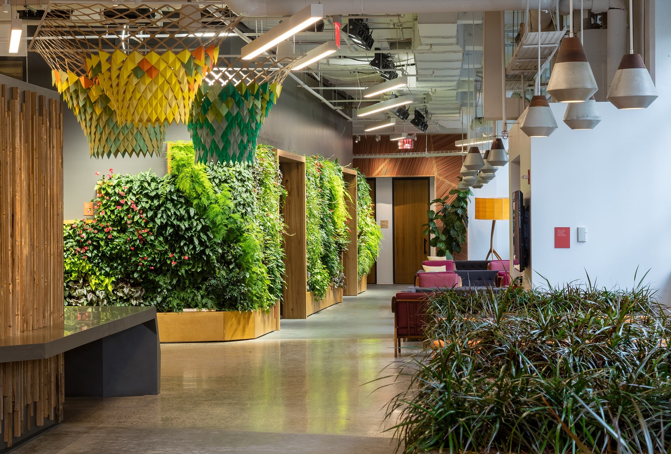 A living wall under integrated architectural grow lighting in a Greenery NYC installation