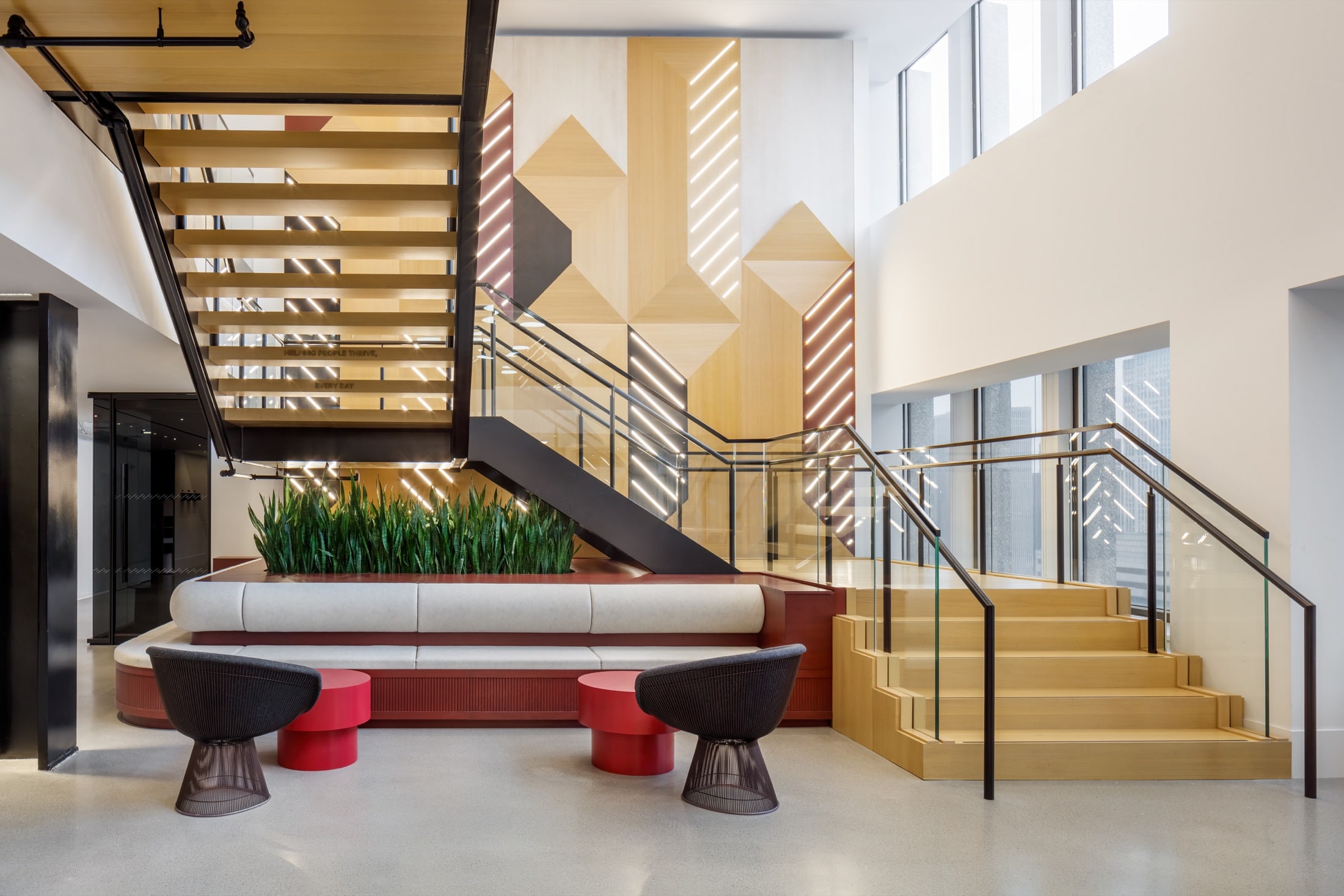 Custom millwork planters wrapping structural columns in an accounting firm's New York office, by Greenery NYC